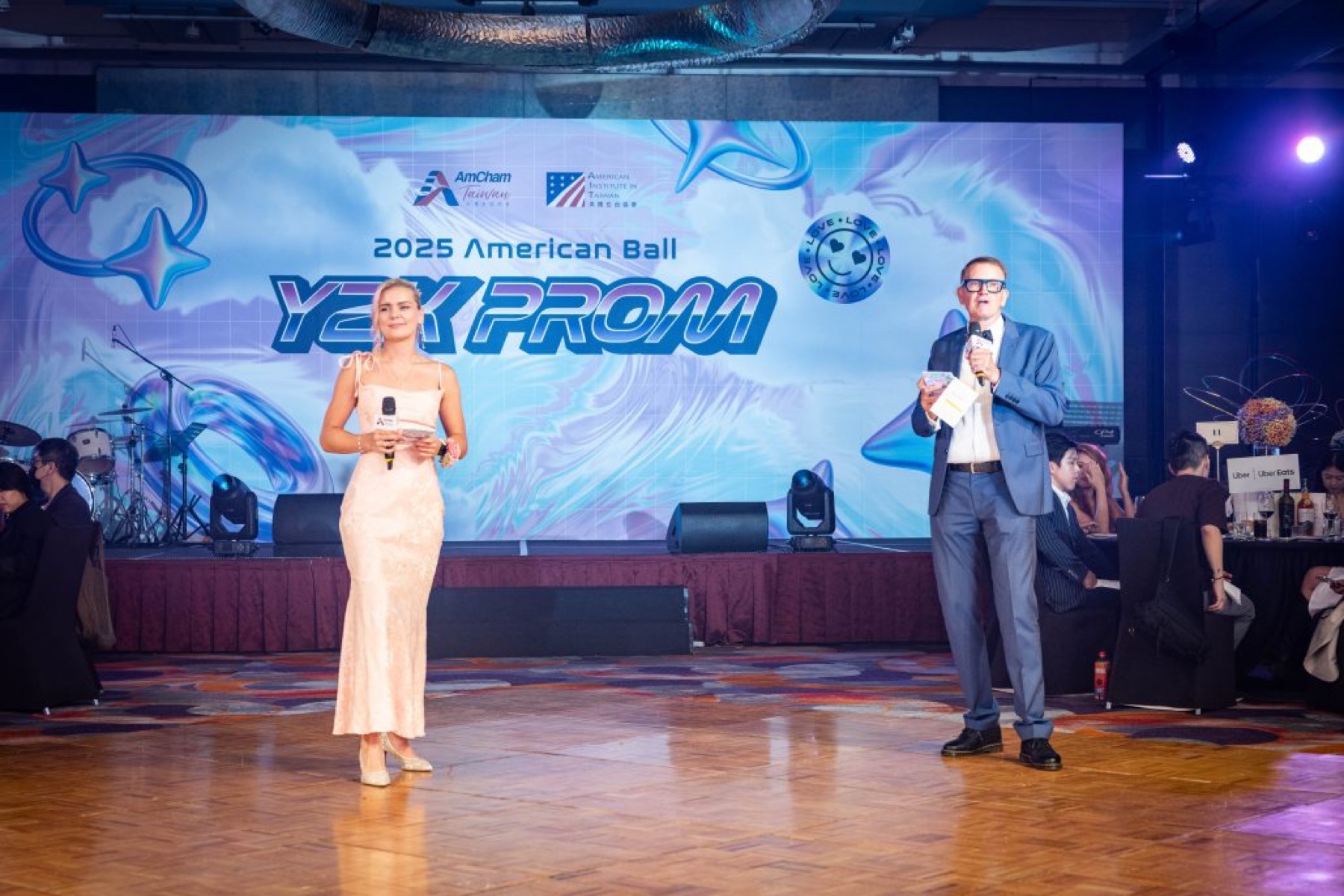 Hosts on stage at an AmCham Taiwan ball